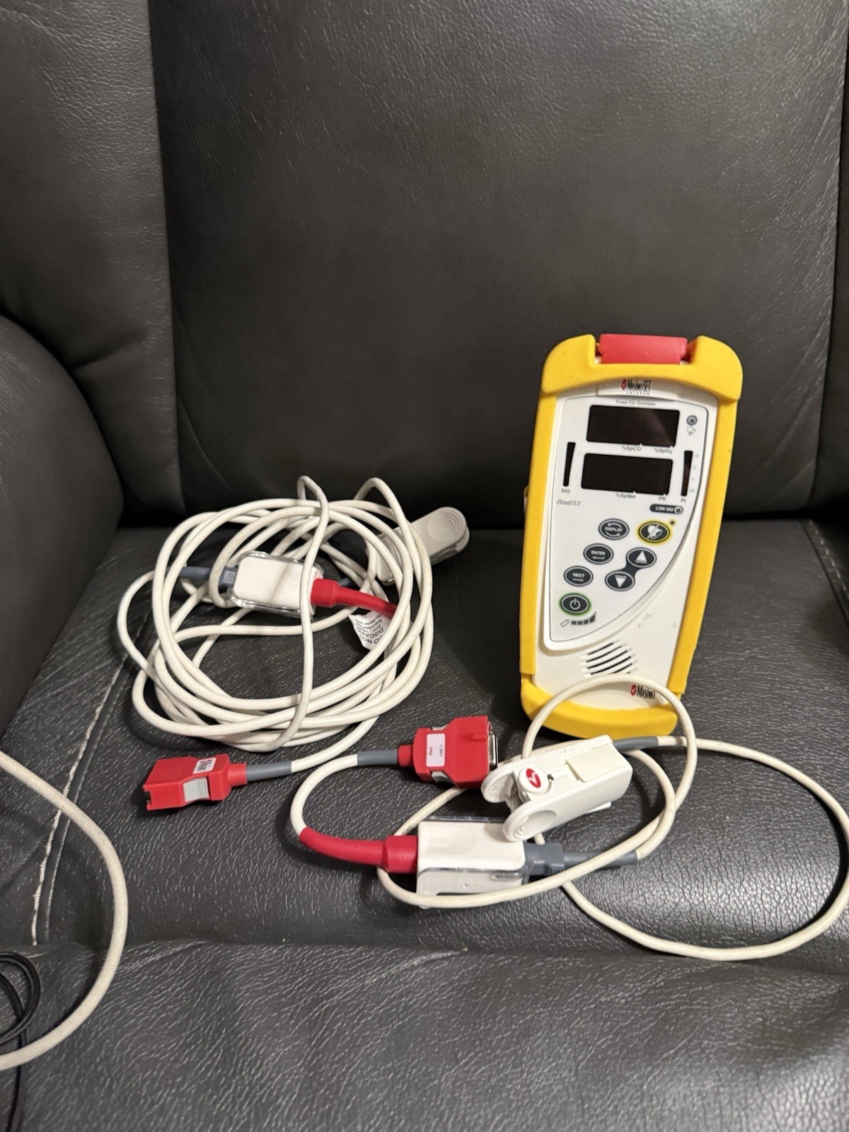 Masimo Rad 57 With Protective Covering And Finger Sensor